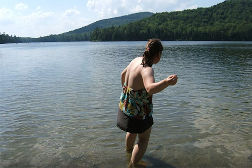 Skipping stones at Kettle Pond
