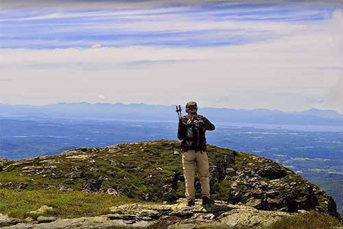 A hiker at the summit in Underhill State Park (photo credit: Summer Wuerthner)