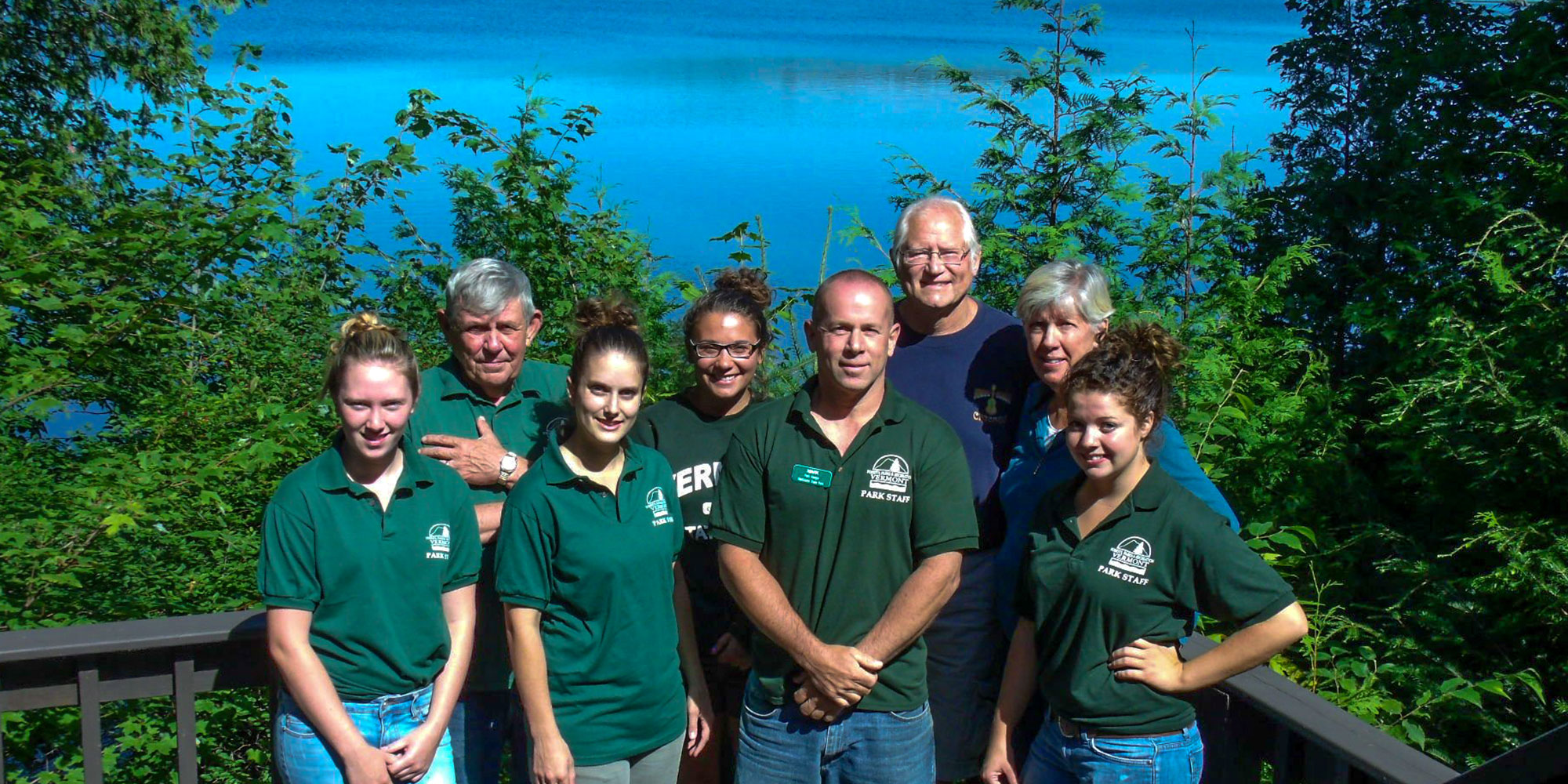 Staff pose in front of a lake