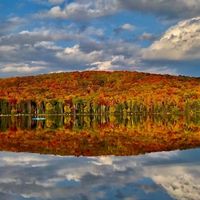Foliage reflects in Ricker Pond